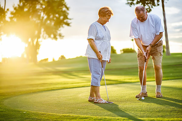 Outdoor Activities on the Florida Gulf Coast Senior Couple playing golf
